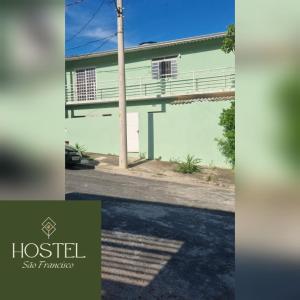 a house on the side of a street at Hostel São Francisco 1 in Votorantim +1 photo