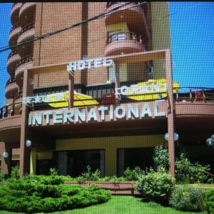 a hotel with a sign that reads international at Hotel Gran International in Villa Gesell