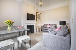 a living room with a couch and a table at 2 Bed in Soulby oc-a28927 in Pooley Bridge