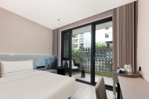 Giường trong phòng chung tại Atour Light Hotel Kunming Tongde Square Baiyun Road