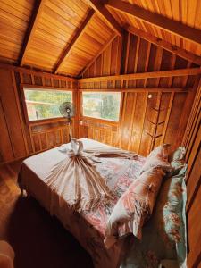 En eller flere senge i et værelse på Pousada Canto da Sereia