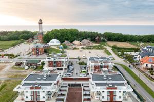 an aerial view of a town with a parking lot at Apartamenty Baltic Horst Basen & Restauracja in Niechorze