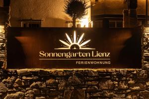 a sign for somersetlearlearlear ivx on a building at Haus Sonnengarten-Lienz in Lienz