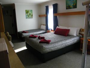 Posteľ alebo postele v izbe v ubytovaní Old Coach Motor Inn Echuca