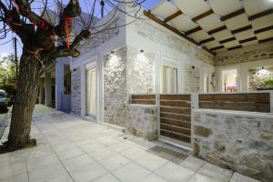 a house with a tree on a sidewalk at luxury house in Ierapetra