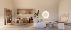 a living room with a white couch and a table at Vouno in Pirgos