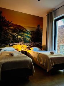 Postel nebo postele na pokoji v ubytování Apartamenty i Pokoje nad Przełomem Dunajca -Rivent