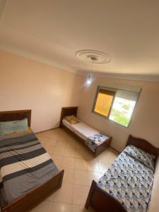 Giường trong phòng chung tại Appartement Vue sur Mer Boumerdès +14 ảnh