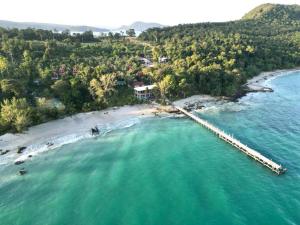 an aerial view of a beach with a dock at Romny cozy bay Resort in Koh Rong Sanloem
