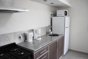 Una cocina o kitchenette en Médano 29 Departamentos en alquiler
