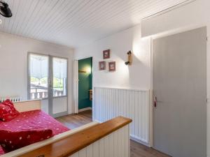 En eller flere senge i et værelse på Appartement au cœur de La Clusaz, animaux acceptés - FR-1-304-7