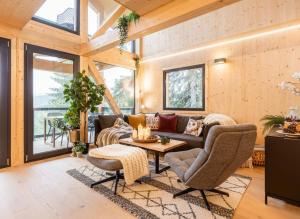 Posezení v ubytování Naturchalets Turracher Höhe by ALPS RESORTS