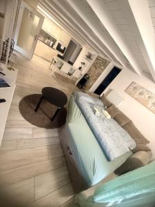 a view of a living room with a bed and a table at Appartment Happy Life - Wimmis - near Spiez-Thun- Interlaken in Wimmis