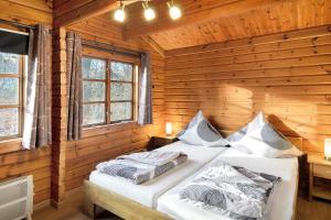 En eller flere senge i et værelse på Twistesee Ferienhaus 110