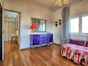 a living room with a purple dresser and a couch at Apartment Wunderschöner Paço D'Arcos by Interhome in Paço de Arcos