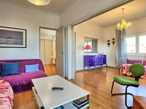 a living room with a couch and a table at Apartment Wunderschöner Paço D'Arcos by Interhome in Paço de Arcos