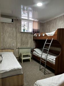 Postel nebo postele na pokoji v ubytování Hostel Sulaiman-Too