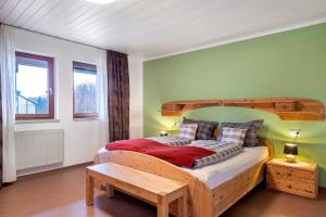 En eller flere senge i et værelse på Ferienwohnungen Im Löwengründle