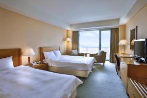 Gulta vai gultas numurā naktsmītnē Hotel Hyundai by Lahan Mokpo