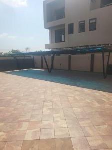 a table on the side of a building at Property for rent in Accra