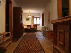 a living room with a kitchen and a dining room at Apartment Davo Tuoi by Interhome in Guarda