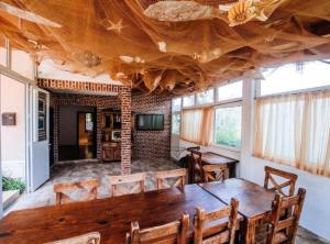 a dining room with a large wooden table and chairs at Holiday Home Villa Rokov in Mali Iž +67 photos