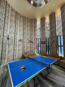 a ping pong table in a room at Pragya Farmhouse in Jodhpur