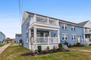 a blue house with a white balcony at 308A E Heather Rd, #3081 in Wildwood Crest