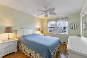 a bedroom with a blue bed and a window at 308A E Heather Rd, #3081 in Wildwood Crest