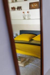 a mirror reflection of a bed in a bedroom at Casa Com Mãos in Marvão +76 photos