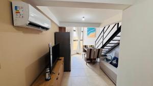 TV a/nebo společenská místnost v ubytování Apartamento Premium na Praia dos Carneiros