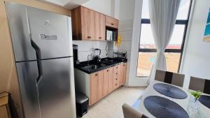 Kuchyň nebo kuchyňský kout v ubytování Apartamento Premium na Praia dos Carneiros