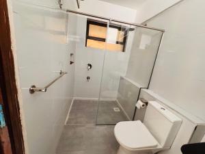 a bathroom with a shower and a toilet at Safari Cozy Homes in Nairobi +5 photos