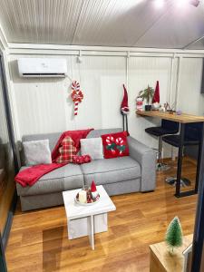 a living room with a couch and a table at Oaza mira Zlatibor, Tornik - ENTIRE HOME at Ski Centar Tornik in Tornik