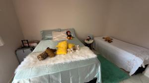 En eller flere senge i et værelse på Casa de Praia à Beira-Mar - Costa Bela + 23 billeder