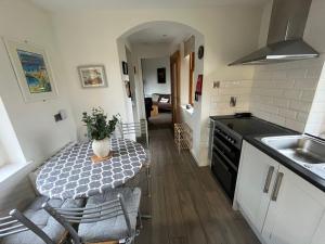 Køkken eller tekøkken på Shetland Cottage Kincraig + 11 billeder