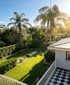 a view of a yard from the balcony of a house at Burwood central home in Sydney