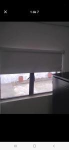 a view of a window with a blind at Casa estrella in Manizales +1 photo