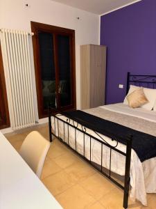 Un pat sau paturi într-o cameră la Hotel Canal Salieri