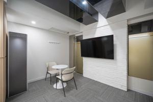 Et tv og/eller underholdning på 스위스벨라 호텔 포항 죽도점