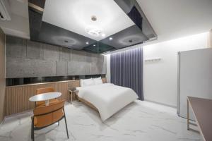 En eller flere senge i et værelse på 스위스벨라 호텔 포항 죽도점