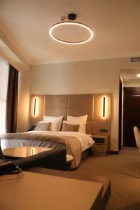 Postel nebo postele na pokoji v ubytování BM Avenue Hotel