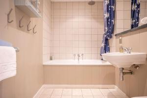 a bathroom with a tub and a sink at Main Street No 56 - Lower Largo in Lower Largo +43 photos