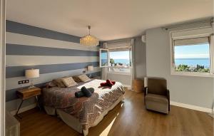 En eller flere senge i et værelse på Casa Benalgabon