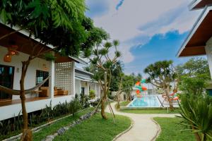 a view of a resort with a swimming pool at Neverland in Ban Tai