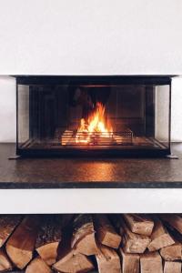 a fireplace with a fire inside of it at Apartment Mountain 4U by Interhome in Meiringen