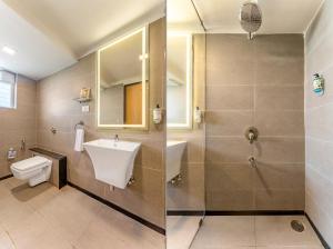 a bathroom with a sink and a toilet and a shower at Treebo Premium Nagpur Automotive Square in Nagpur