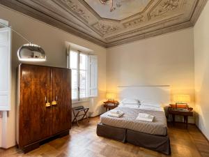 Кровать или кровати в номере Hotel la Scala