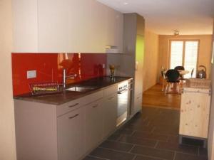 a kitchen with a sink and a stove top oven at Apartment Hof Quadra by Interhome in Flerden
