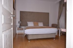 Postel nebo postele na pokoji v ubytování Bilge Suite Hotel